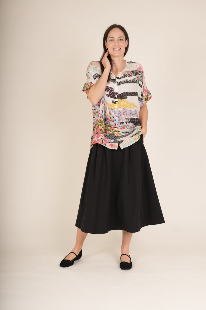 Blusa de té blanca de primavera