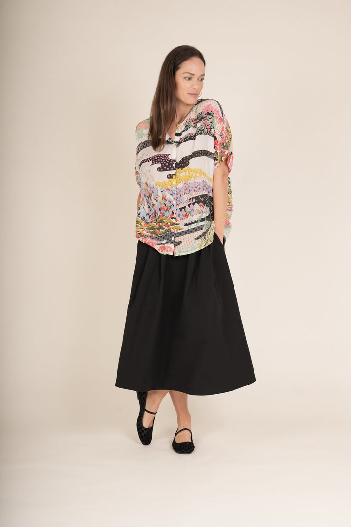 Blusa de té blanca de primavera